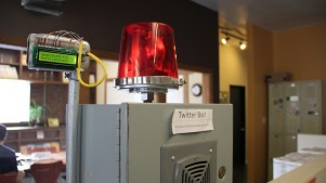 A Twitter alarm box at Office Nomads in Seattle. The siren goes off whenever @officenomads is tweeted.